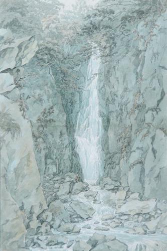 A traveller standing by a waterfall